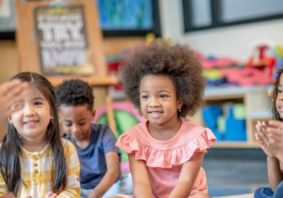 group-of-preschool-students-in-class Children at Embrace Life Child Care, the Best Preschool in Peoria County IL, listen during storytime.