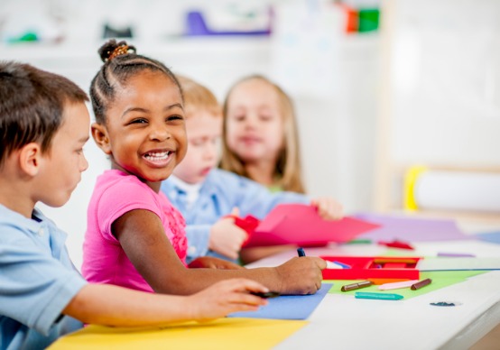 children-playing A child smiles at the camera at Embrace Life Child Care, which is a top Preschool Near You when you're in the Edwards IL area.