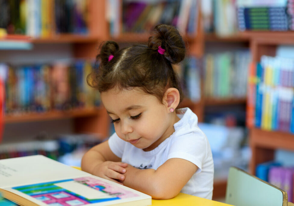 Little girl enjoying reading time